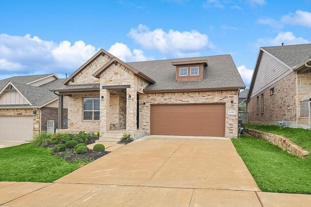 view of front facade with a front yard and a garage