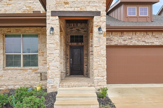 entrance to property featuring a garage