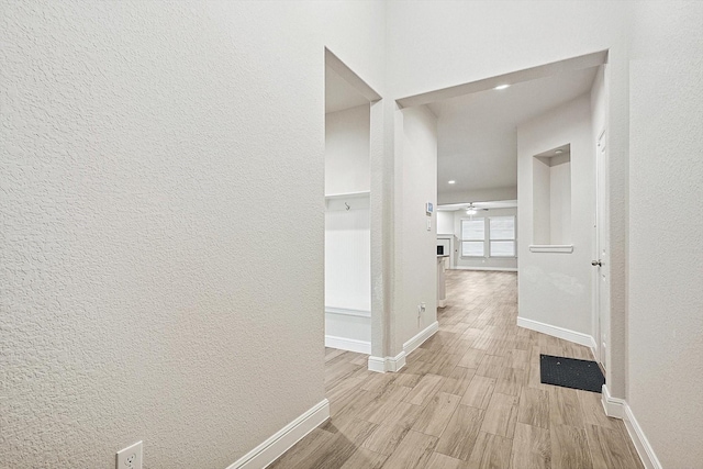 hallway with light wood-type flooring