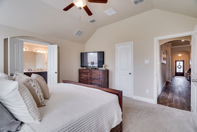 bedroom with dark carpet, ceiling fan, and lofted ceiling