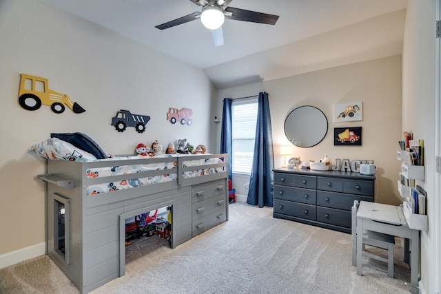 bedroom featuring ceiling fan, light colored carpet, and lofted ceiling