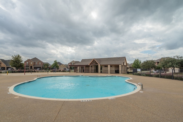 view of swimming pool with a patio