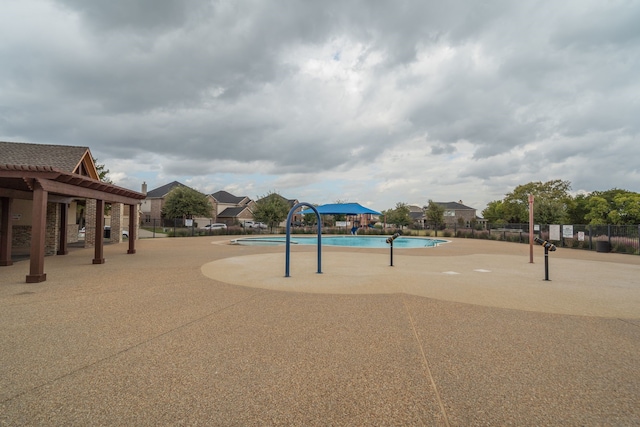 view of home's community featuring a patio and a swimming pool