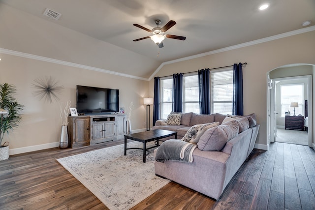 living room with ceiling fan, lofted ceiling, ornamental molding, and dark wood-type flooring