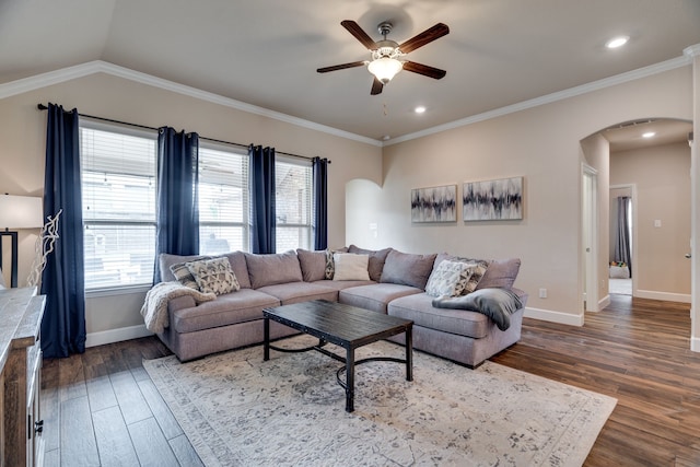 living room featuring crown molding, ceiling fan, wood-type flooring, and vaulted ceiling