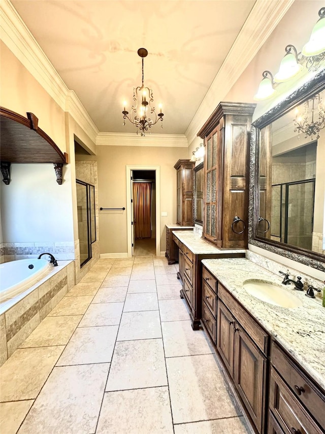 bathroom with ornamental molding, a sink, an inviting chandelier, a shower stall, and a bath