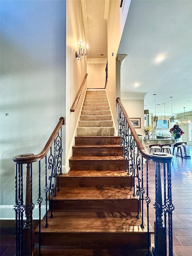 stairs with recessed lighting, wood finished floors, visible vents, and baseboards