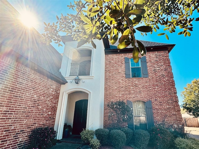 exterior space featuring brick siding