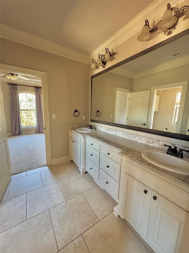 full bathroom with tile patterned flooring, ornamental molding, and a sink