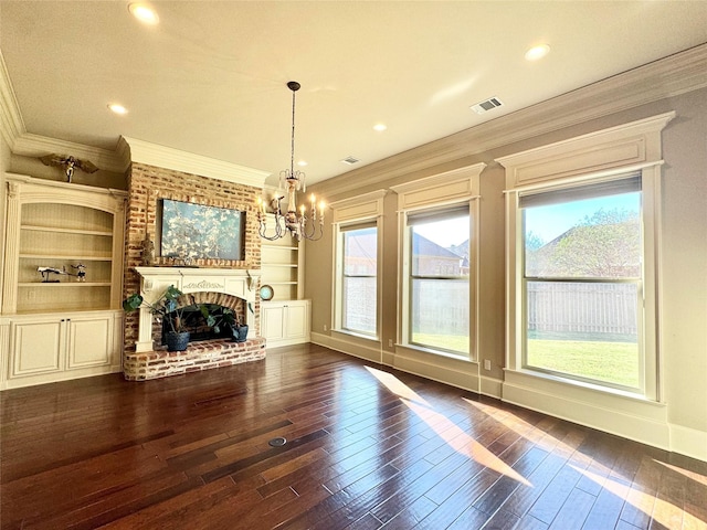 unfurnished living room featuring a brick fireplace, crown molding, visible vents, and dark wood-type flooring