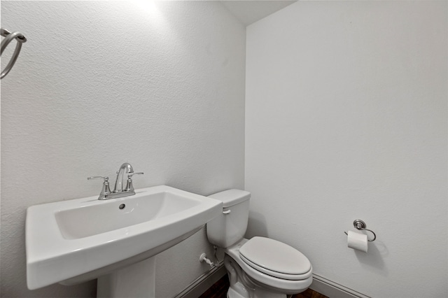 bathroom with toilet and sink