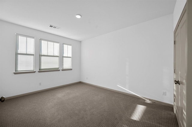 empty room featuring carpet flooring