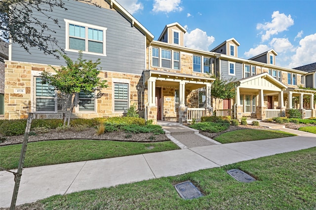 view of front of house with a front lawn and a porch