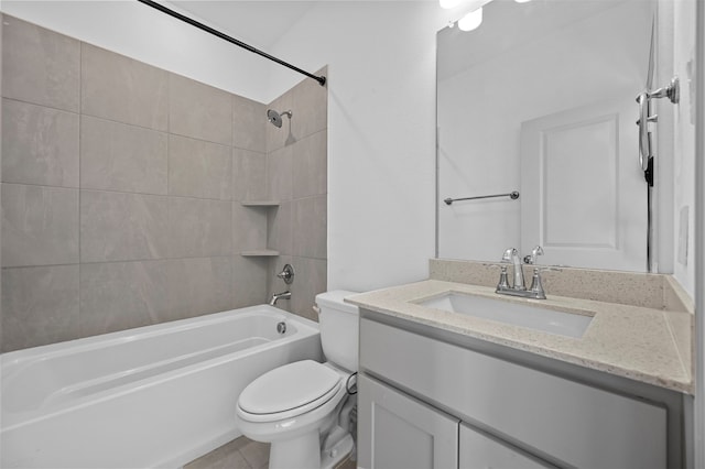 full bathroom with tiled shower / bath, vanity, and toilet