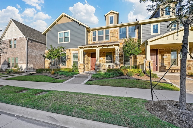 view of front facade featuring a front yard and a porch