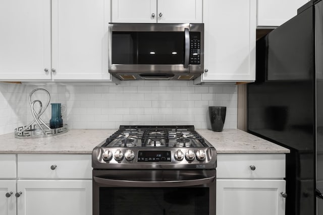 kitchen featuring appliances with stainless steel finishes and white cabinetry