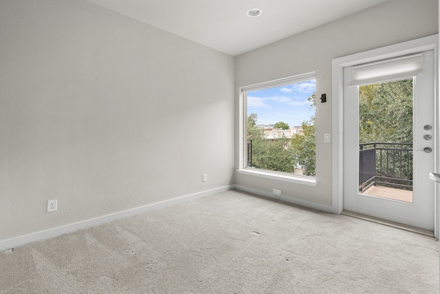 empty room featuring light carpet