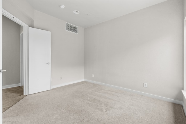 unfurnished bedroom with light colored carpet