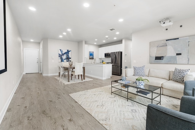 living room with light hardwood / wood-style floors