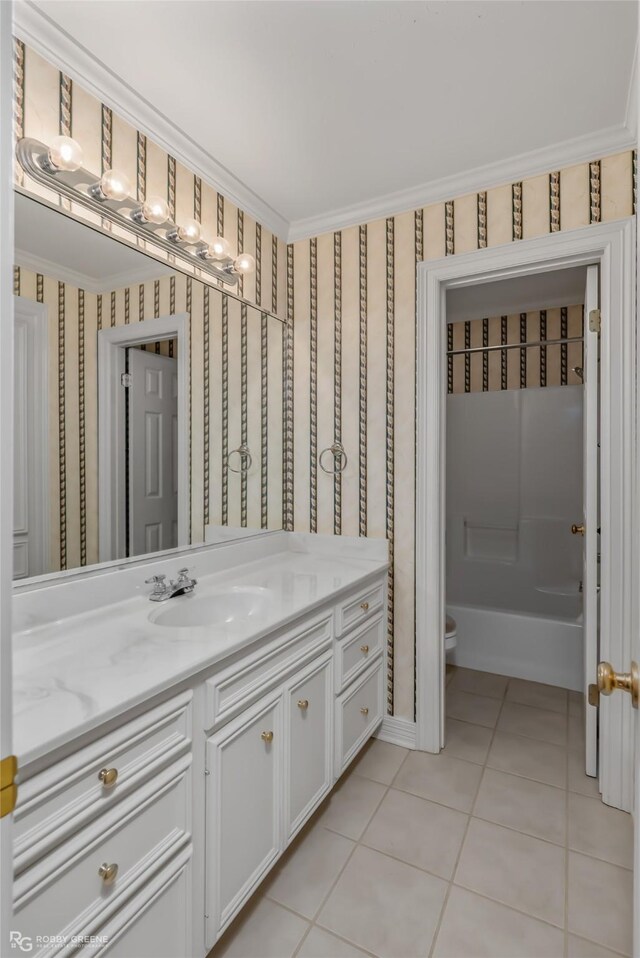 carpeted spare room featuring crown molding and ceiling fan