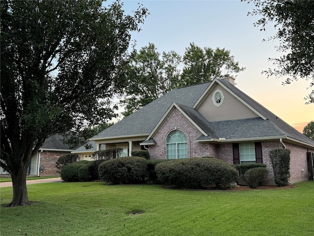 view of front of house with a yard