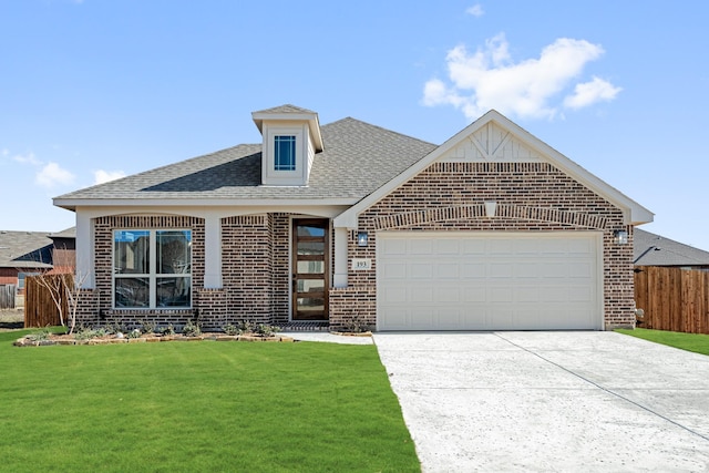 view of front facade with a garage and a front lawn