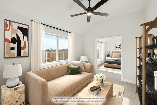 carpeted living room featuring lofted ceiling and ceiling fan