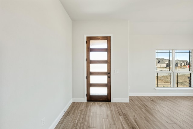 entryway with light hardwood / wood-style flooring