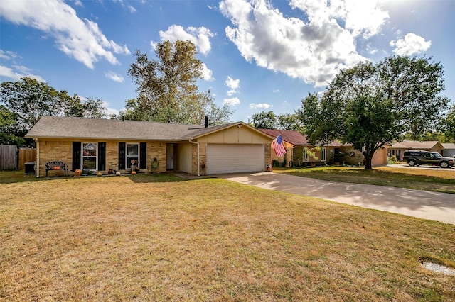 ranch-style home with a garage and a front yard