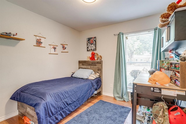 bedroom with light wood-type flooring