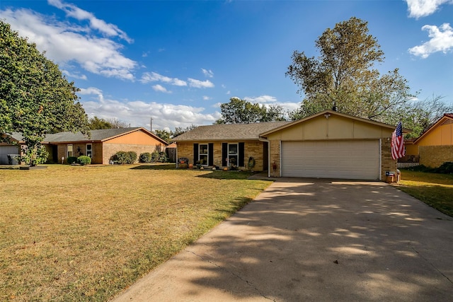 single story home featuring a front lawn and a garage