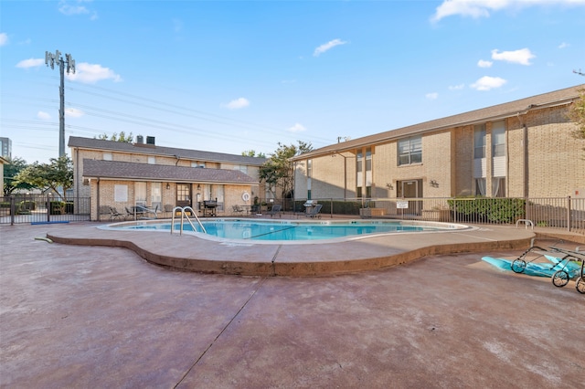 view of pool featuring a patio