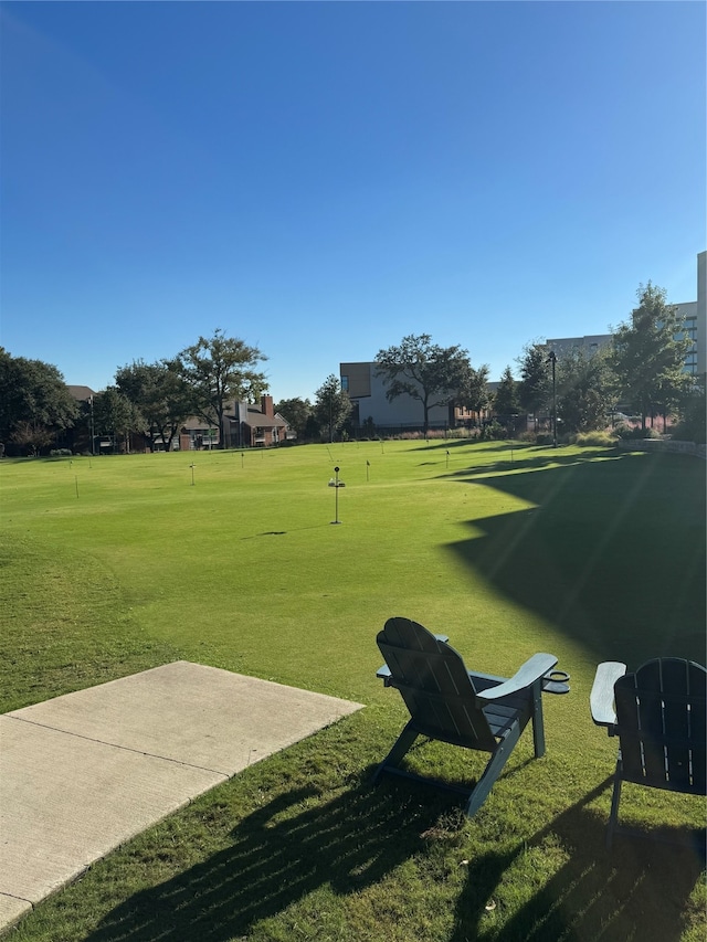 view of property's community featuring a yard