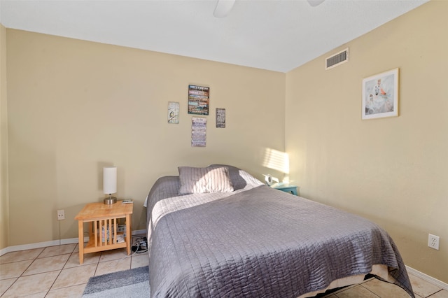 bedroom featuring light tile patterned floors and ceiling fan