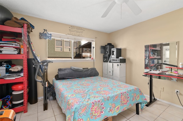 tiled bedroom featuring ceiling fan