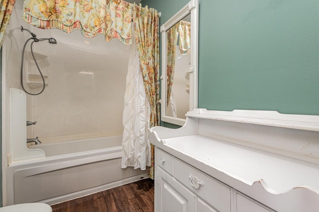 bathroom with shower / bath combo with shower curtain and hardwood / wood-style floors