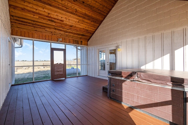 unfurnished sunroom with french doors, a hot tub, vaulted ceiling, and wood ceiling