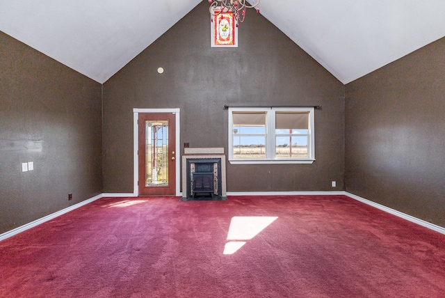 unfurnished living room featuring carpet and high vaulted ceiling