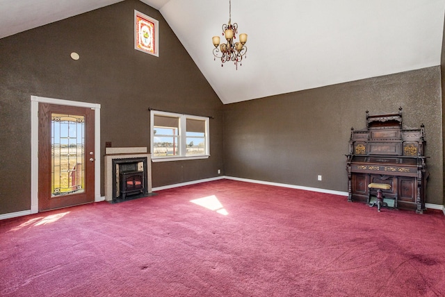 unfurnished living room featuring carpet, a notable chandelier, and high vaulted ceiling