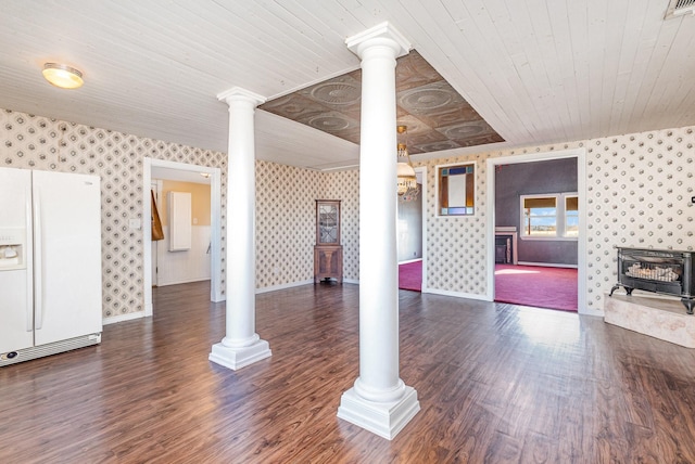 unfurnished living room with a wood stove, dark wood-type flooring, and wood ceiling