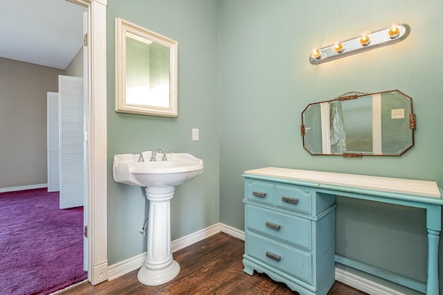 bathroom with hardwood / wood-style floors