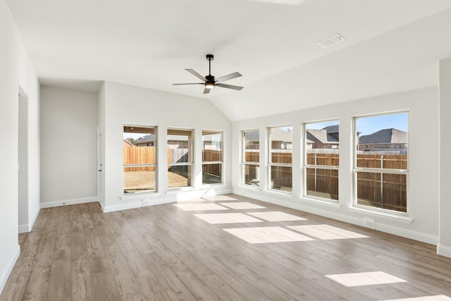 unfurnished sunroom featuring lofted ceiling and ceiling fan