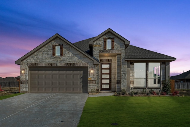 view of front of house with a lawn and a garage