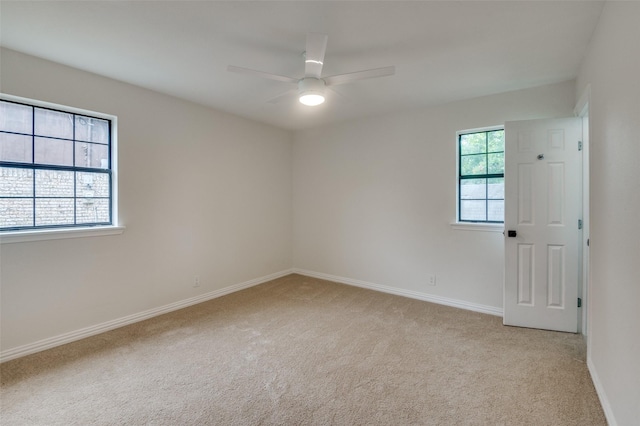 carpeted empty room with ceiling fan