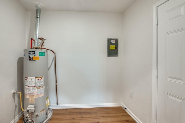 utility room featuring water heater