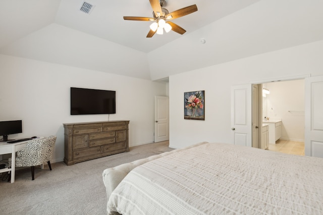 bedroom with connected bathroom, ceiling fan, lofted ceiling, and light colored carpet