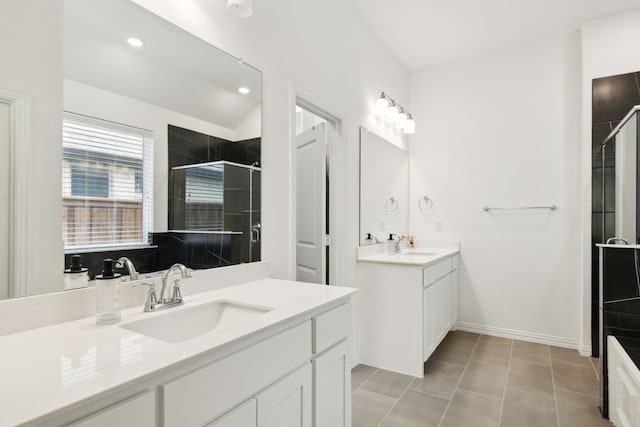 bathroom with vanity, an enclosed shower, and tile patterned floors