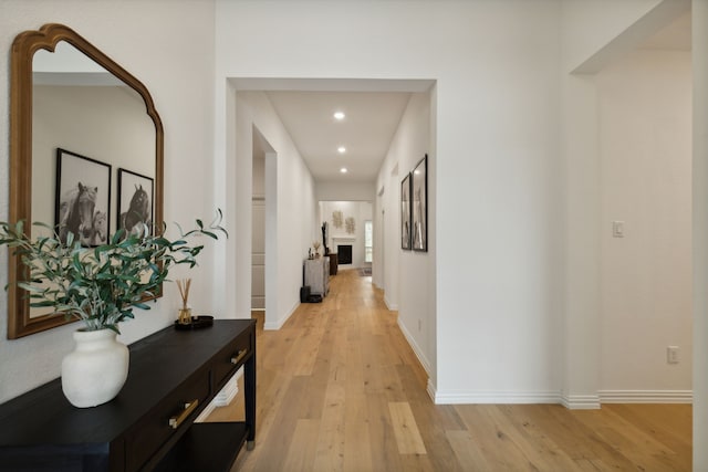 corridor with light wood-type flooring