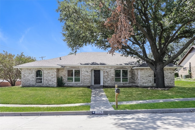 ranch-style home with a front yard