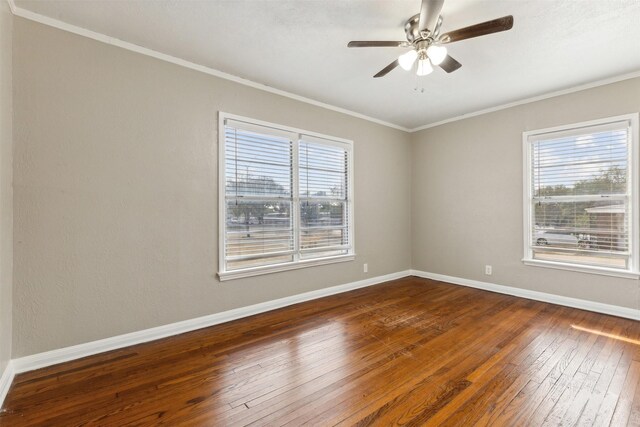 unfurnished room featuring baseboards, ceiling fan, dark wood-style floors, and ornamental molding
